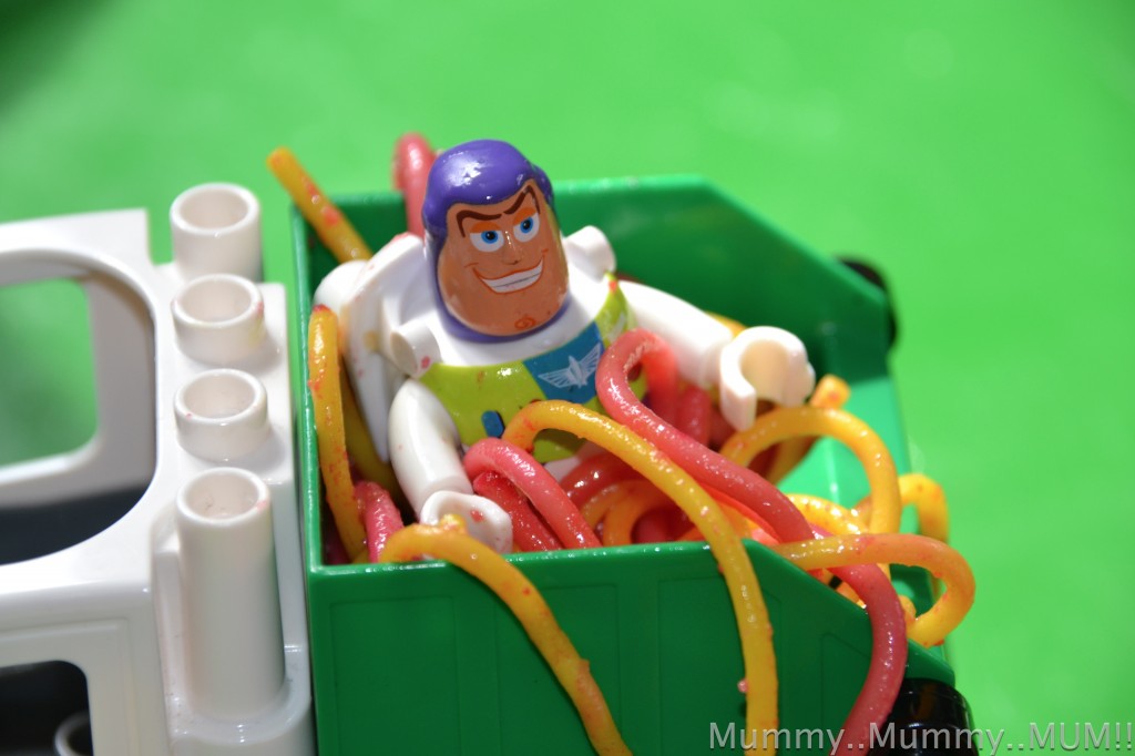 LEGO DUPLO Buzz Lightyear in a rubbish truck with slimy spaghetti for a sensory play activity