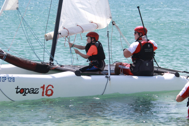 boy and instructor sailing