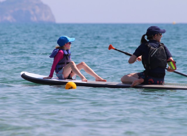 Mum and child paddleboard