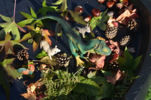 Schleich dinosaurs in a small world play set up