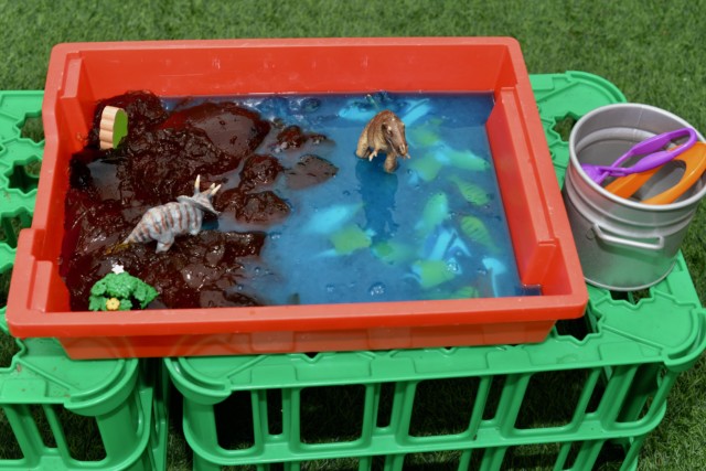 Dinosaur jelly play in a gratnells container
