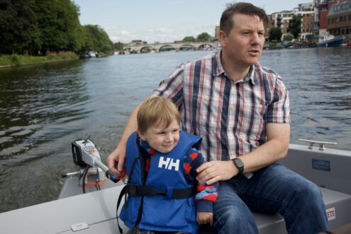 Dad and child on a goBoat adventure down the Thames