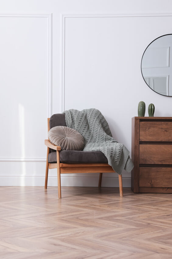 Modern living room with parquet flooring and stylish furniture