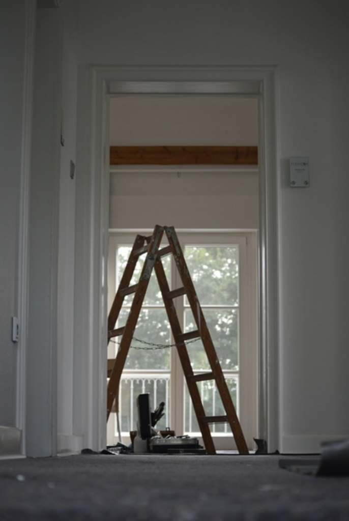 ladder in a hallway being decorated