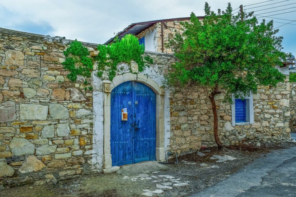 blue gate in a brick wall