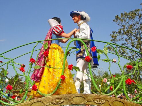 Disney prince and princess in a parade