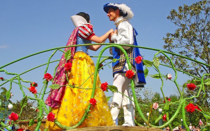 Disney prince and princess in a parade