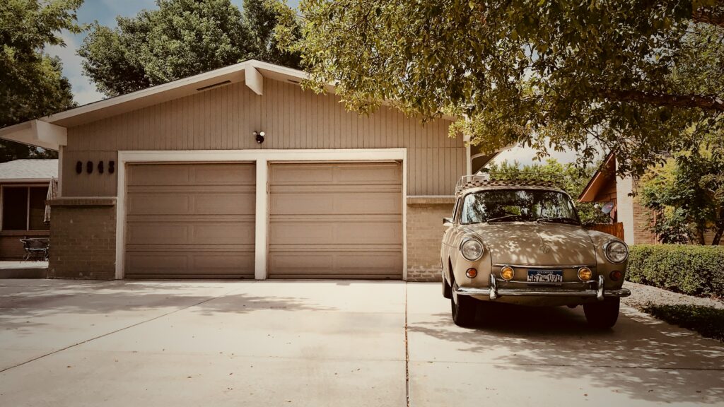 old fashioned double garage and car