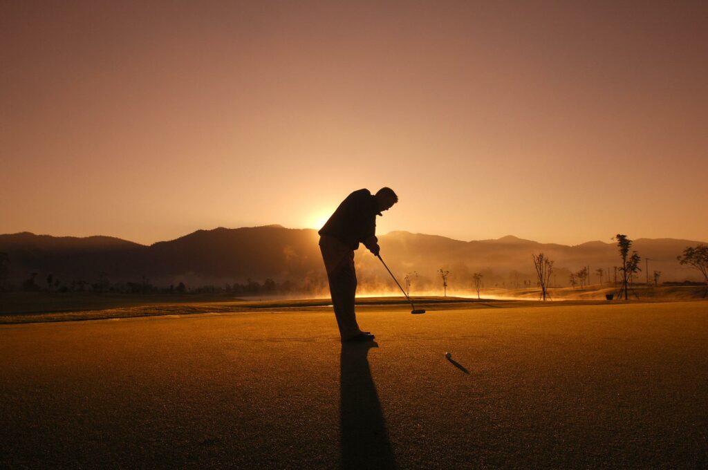 Golfer at sunset