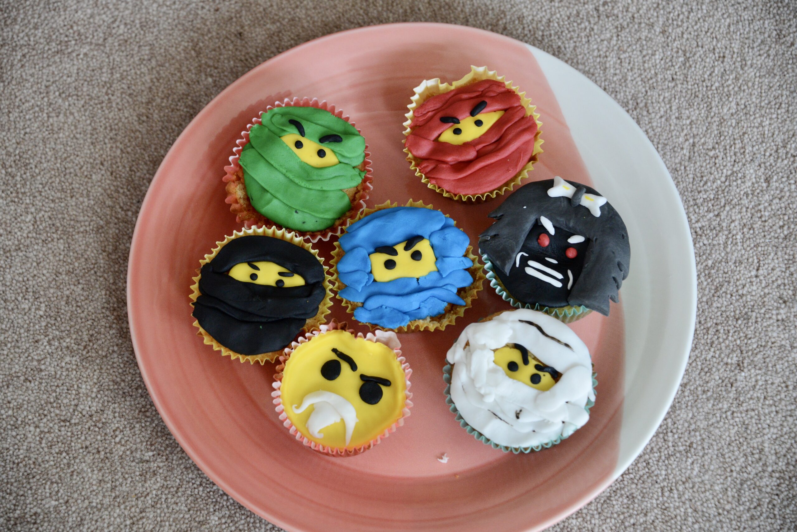 Ninjago cupcakes including Kai, Zane, Cole, Lord Garmaddon and Master Wu
