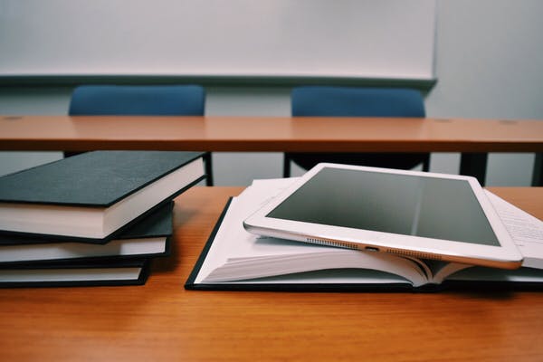 books and an iPad on a school desk