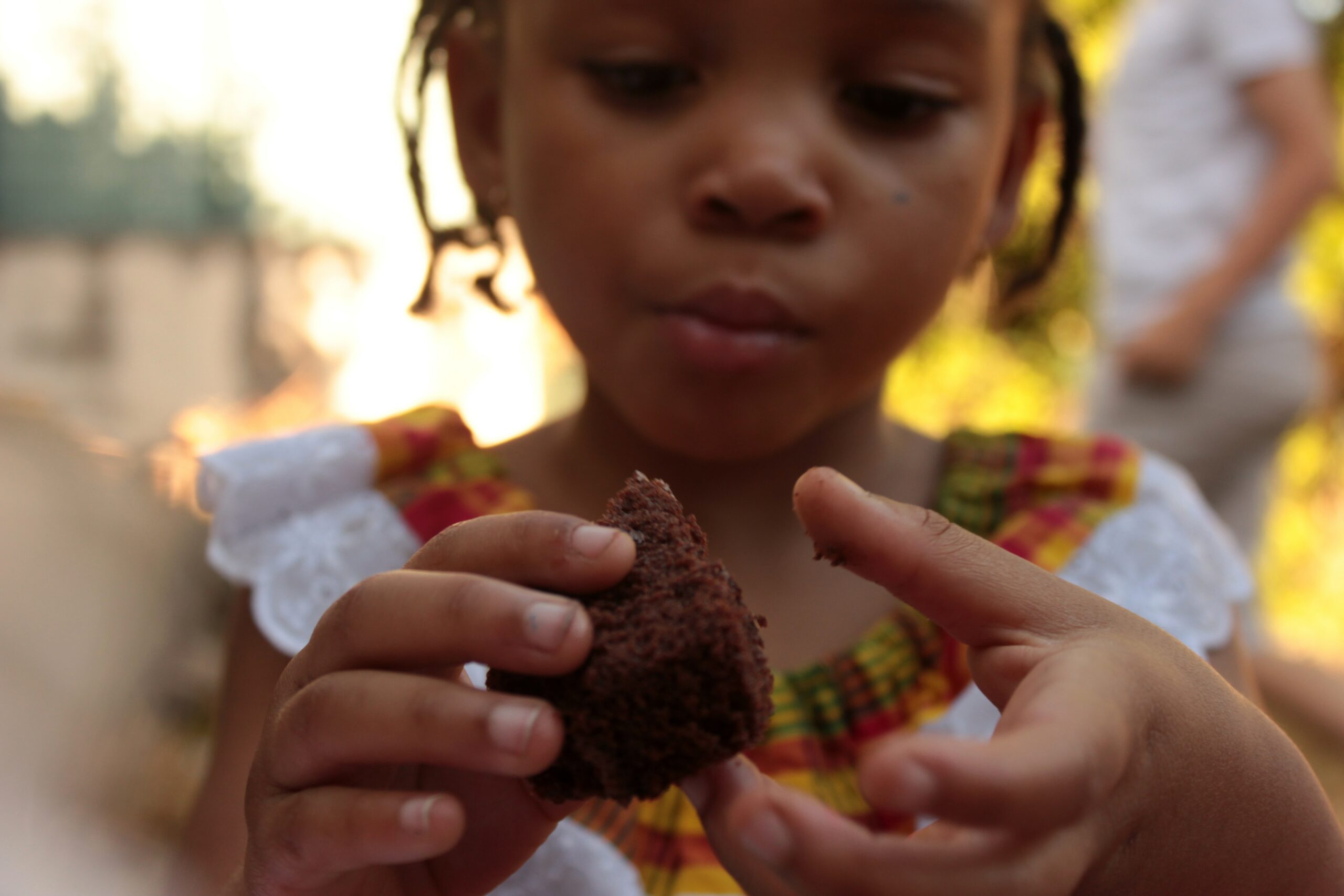 child eating cake