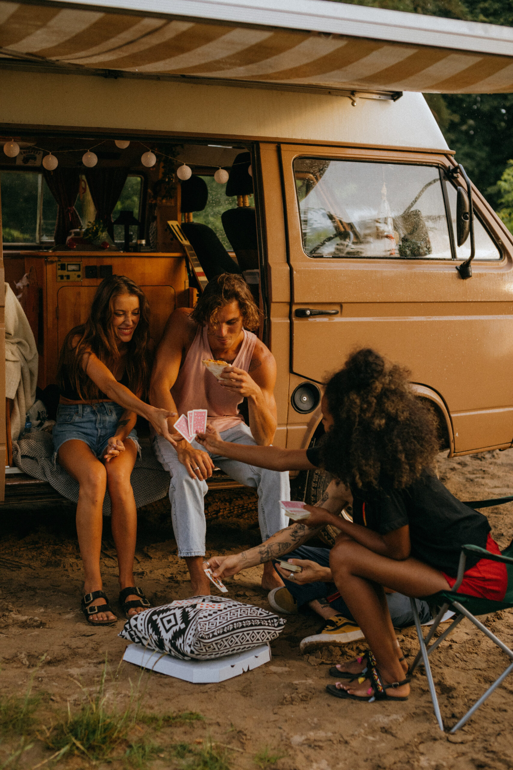 Young people outside a camper van