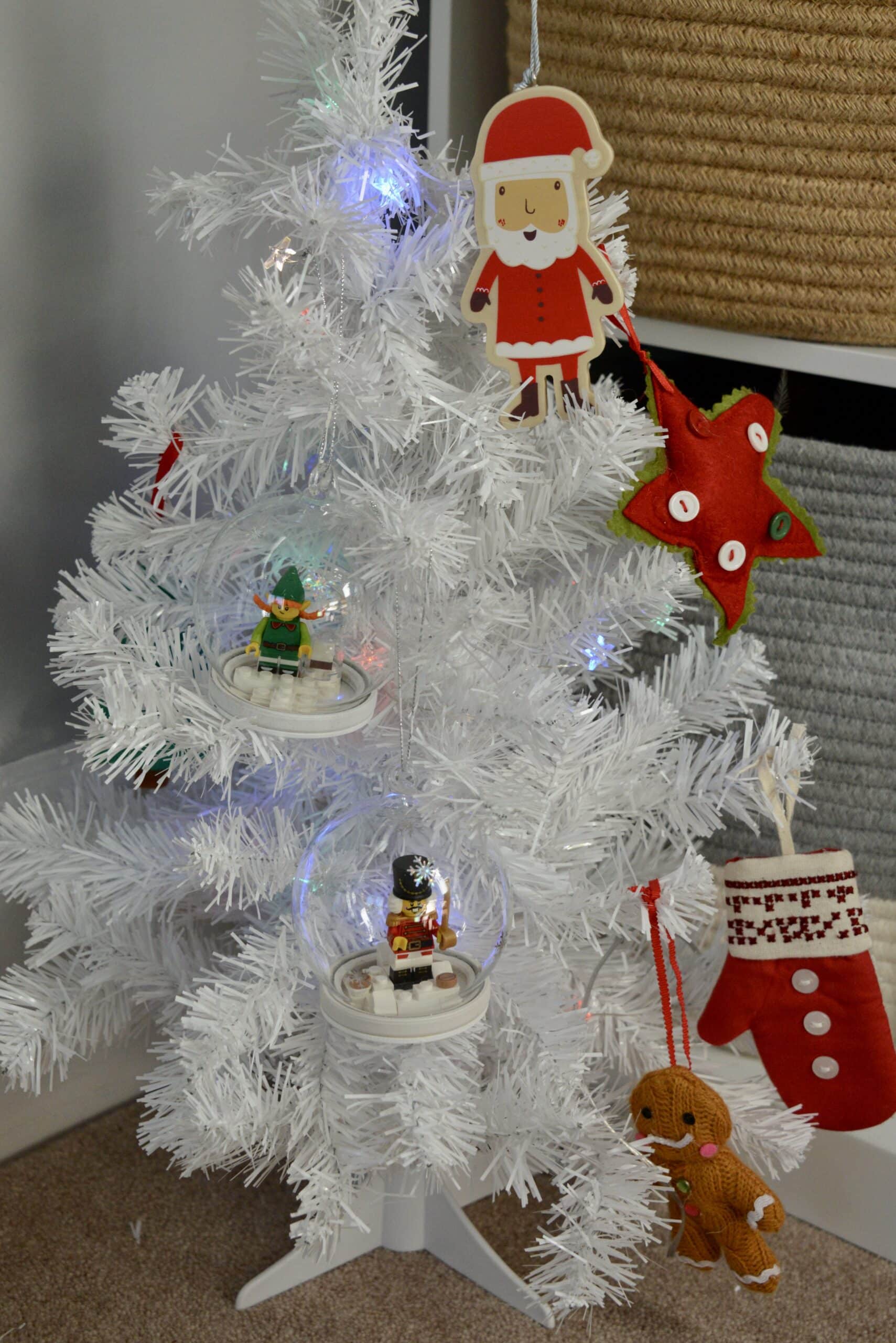 Small white tree with two homemade LEGO tree decorations