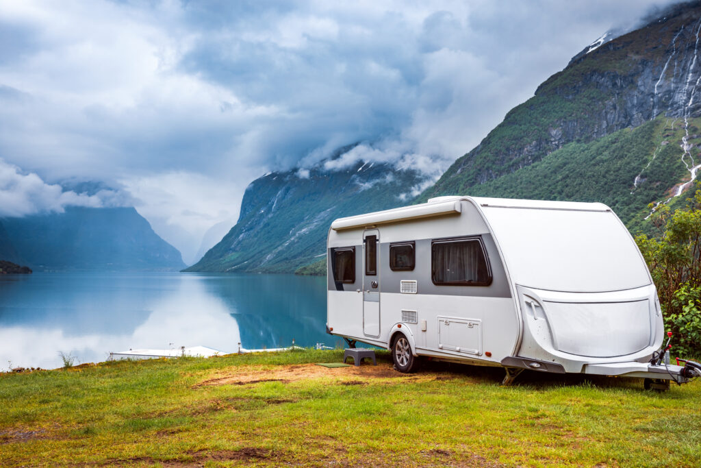 Family vacation travel RV, holiday trip in motorhome, Caravan car Vacation. Beautiful Nature Norway natural landscape.