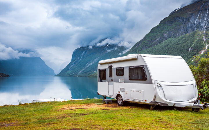 Family vacation travel RV, holiday trip in motorhome, Caravan car Vacation. Beautiful Nature Norway natural landscape.