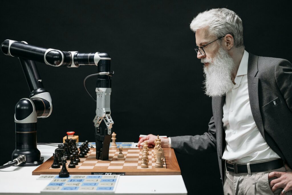Man playing chess with a robot